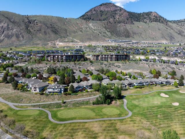 Discover your sanctuary at Sun Rivers Resort Community, where golf and nature blend seamlessly. This ground-floor condo in Kamloops offers full southern exposure and swift downtown access, combining convenience with the tranquility of resort living. Featuring 2 bedrooms, 2 bathrooms, and a den, the space is perfected with all-new appliances and a highly efficient ground source heat pump for optimal comfort. Step outside to a spacious patio, ideal for entertaining or savoring your morning coffee as you watch big horn sheep and wild chukkars roam freely. Included amenities enhance your lifestyle: secure underground parking, a storage locker, an on-site restaurant, new retail spaces, and direct city bus service. Plus, with a golf course at your doorstep, every day is an opportunity to play. Pet-friendly and allowing rentals, this condo is not just a home but a promise of unforgettable experiences and ease.