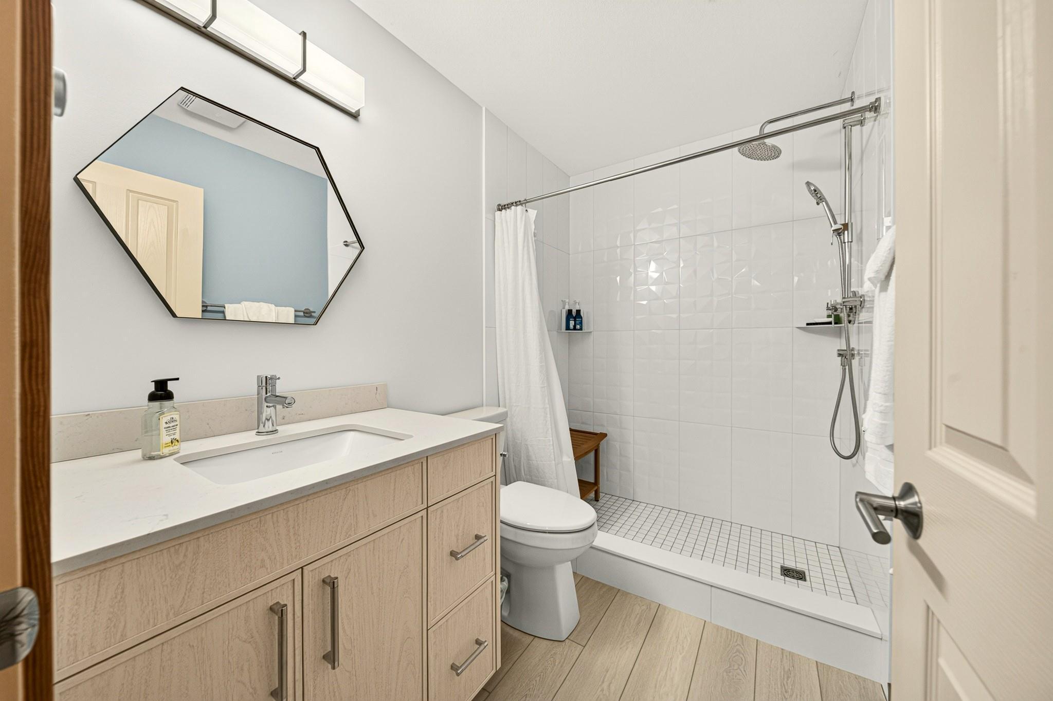 Bright bathroom at Unit 304, renovated in 2025